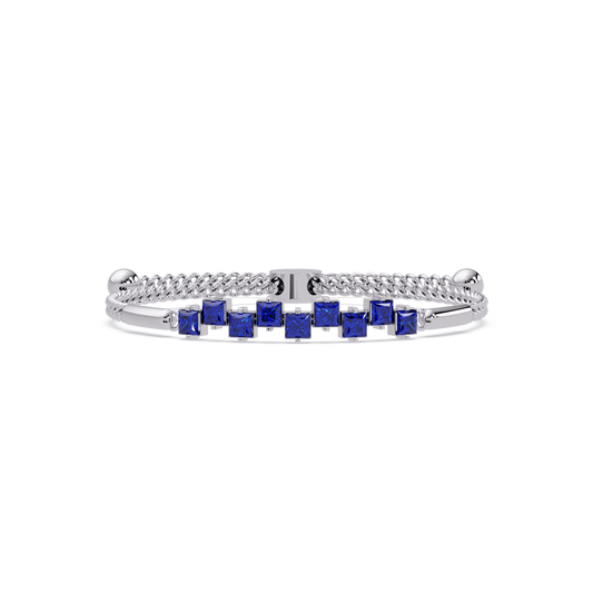 Nine princess-cut sapphire colorstones in a white gold chain-accent cuff bracelet