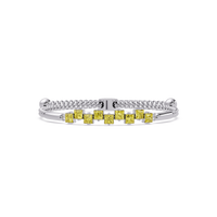 Nine princess-cut yellow colorstones in a white gold chain-accent cuff bracelet