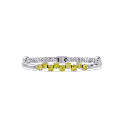 Nine princess-cut yellow colorstones in a white gold chain-accent cuff bracelet