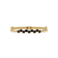 Nine princess-cut onyx colorstones in a yellow gold chain-accent cuff bracelet