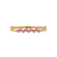 Nine princess-cut pink colorstones in a yellow gold chain-accent cuff bracelet