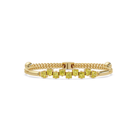 Nine princess-cut yellow colorstones in a yellow gold chain-accent cuff bracelet