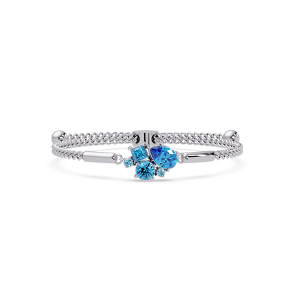 Mixed-cut five-stone colorstone open bangle with aquamarine stones in white gold