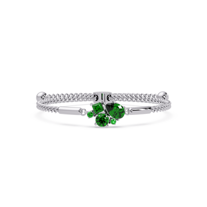 Mixed-cut five-stone colorstone open bangle with green stones in white gold