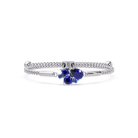 Mixed-cut five-stone colorstone open bangle with sapphire stones in white gold