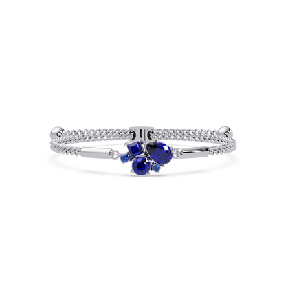 Mixed-cut five-stone colorstone open bangle with sapphire stones in white gold