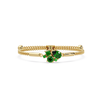 Mixed-cut five-stone colorstone open bangle with green stones in yellow gold