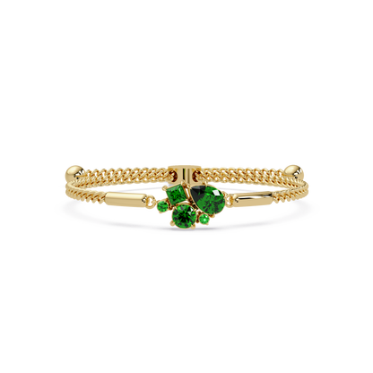 Mixed-cut five-stone colorstone open bangle with green stones in yellow gold