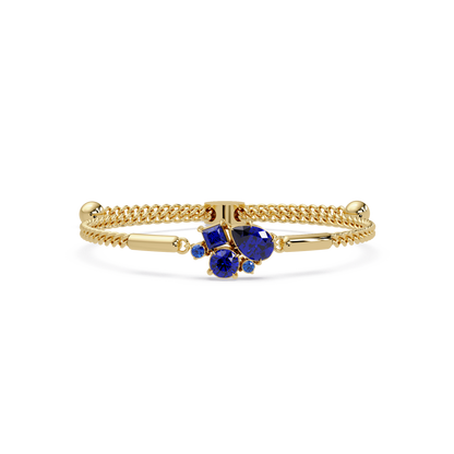 Mixed-cut five-stone colorstone open bangle with sapphire stones in yellow gold