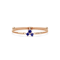 Three-stone colorstone adjustable chain bracelet with sapphire blue stones in rose gold