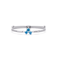 Three-stone colorstone adjustable chain bracelet with aquamarine blue stones in white gold
