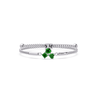 Three-stone colorstone adjustable chain bracelet with emerald green stones in white gold
