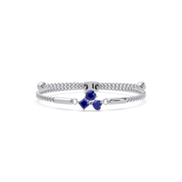 Three-stone colorstone adjustable chain bracelet with sapphire blue stones in white gold