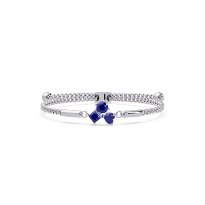 Three-stone lab-grown colorstone adjustable chain bracelet with sapphire blue stones in white gold