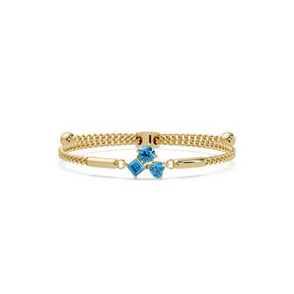 Three-stone lab-grown colorstone adjustable chain bracelet with aquamarine blue stones in yellow gold