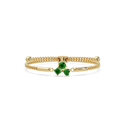 Three-stone lab-grown colorstone adjustable chain bracelet with emerald green stones in yellow gold