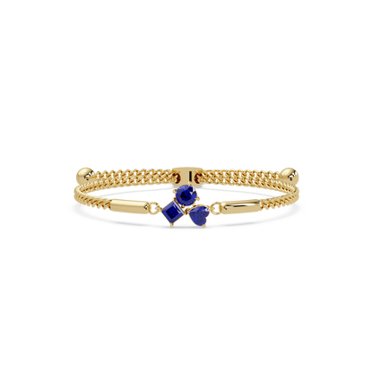 Three-stone lab-grown colorstone adjustable chain bracelet with sapphire blue stones in yellow gold