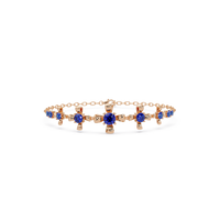 Nine-stone round colorstone chain bracelet, sapphire blue gemstones in rose gold