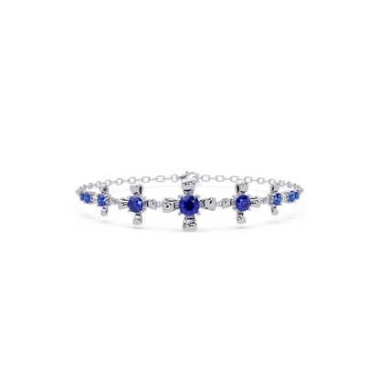 Nine-stone round colorstone chain bracelet, sapphire blue gemstones in white gold