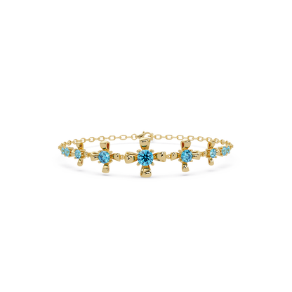 Nine-stone round colorstone chain bracelet, aquamarine blue gemstones in yellow gold
