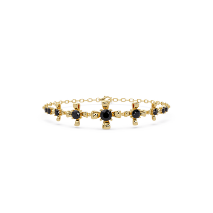 Nine-stone round colorstone chain bracelet, onyx gemstones in yellow gold