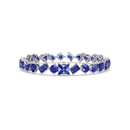 Five-shape sapphire blue colorstone tennis bracelet in white gold