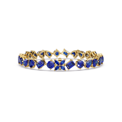 Five-shape sapphire blue colorstone tennis bracelet in yellow gold