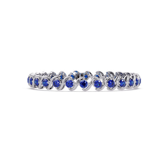 Round sapphire blue colorstone swirl-link tennis bracelet in white gold
