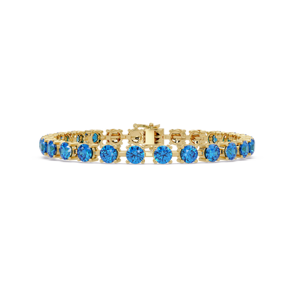 Classic round aquamarine blue colorstone tennis bracelet in yellow gold