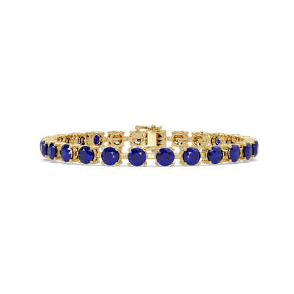Classic round sapphire blue colorstone tennis bracelet in yellow gold