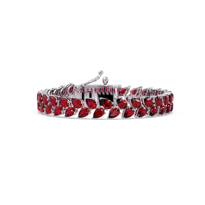 Pear-cut red colorstone tennis bracelet in white gold