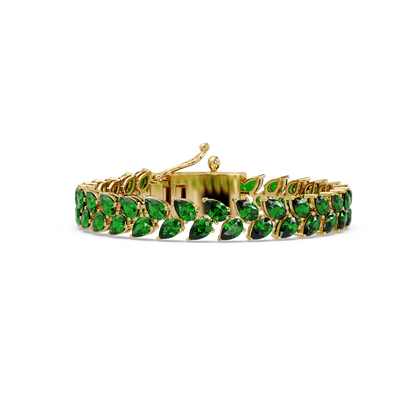 Pear-cut green colorstone tennis bracelet in yellow gold
