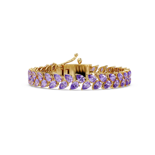 Pear-cut purple colorstone tennis bracelet in yellow gold