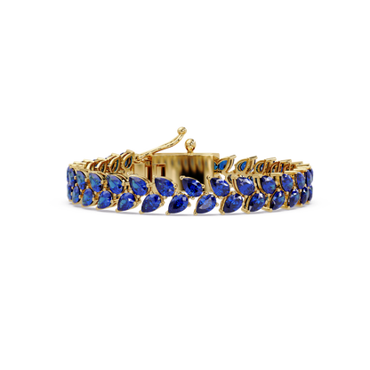Pear-cut sapphire colorstone tennis bracelet in yellow gold