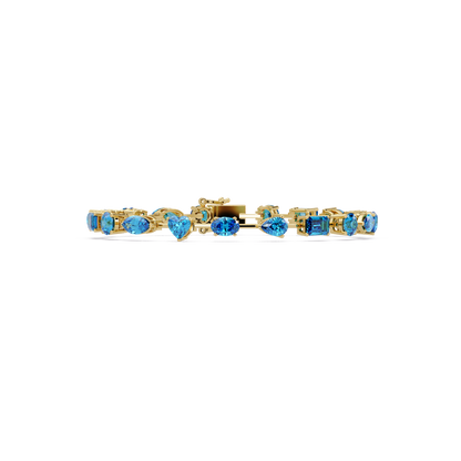 Mixed-shape aquamarine colorstone tennis bracelet in yellow gold