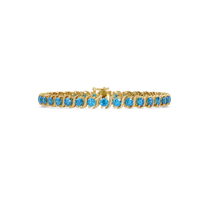 Round aquamarine colorstone tennis bracelet in yellow gold