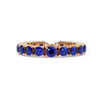 Round sapphire blue colorstone bangle in rose gold
