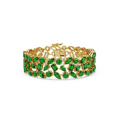 Mixed-shape emerald green colorstone tennis bracelet in yellow gold
