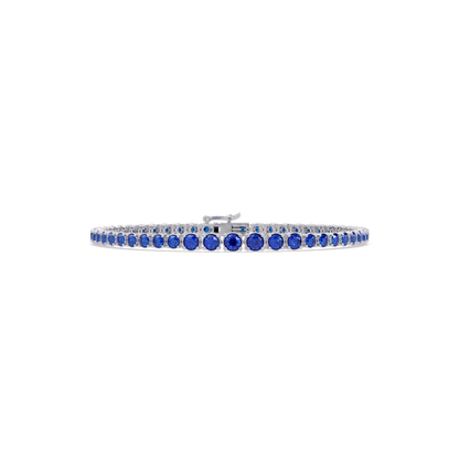 Graduated round sapphire blue colorstone tennis bracelet in white gold