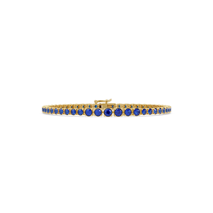 Graduated round sapphire blue colorstone tennis bracelet in yellow gold