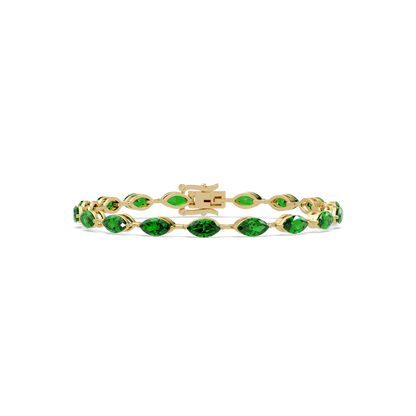 Marquise emerald green colorstone tennis bracelet in yellow gold