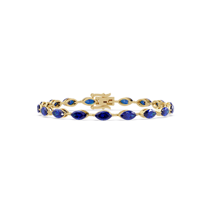 Marquise sapphire blue colorstone tennis bracelet in yellow gold