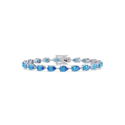 Pear-cut aquamarine blue colorstone tennis bracelet in white gold