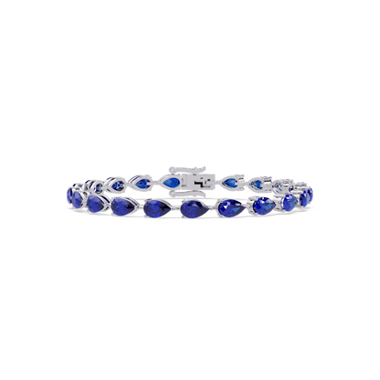 Pear-cut sapphire blue colorstone tennis bracelet in white gold
