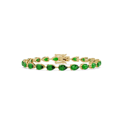 Pear-cut emerald green colorstone tennis bracelet in yellow gold