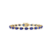 Pear-cut sapphire blue colorstone tennis bracelet in yellow gold