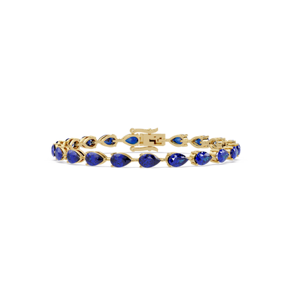 Pear-cut sapphire blue colorstone tennis bracelet in yellow gold