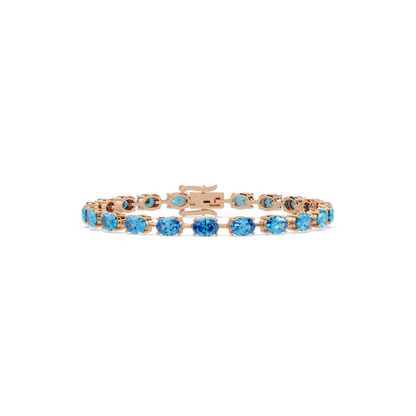Oval-cut aquamarine blue colorstone tennis bracelet in rose gold