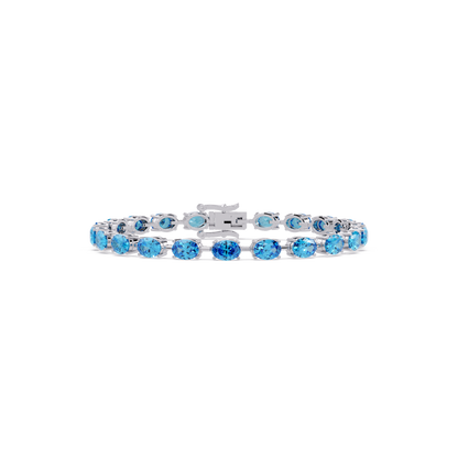 Oval-cut aquamarine blue colorstone tennis bracelet in white gold