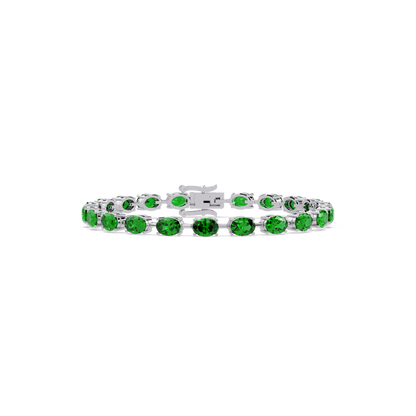 Oval-cut emerald green colorstone tennis bracelet in white gold